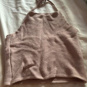 Backless around the neck tan top. Not tags but does fit a Small Adult.